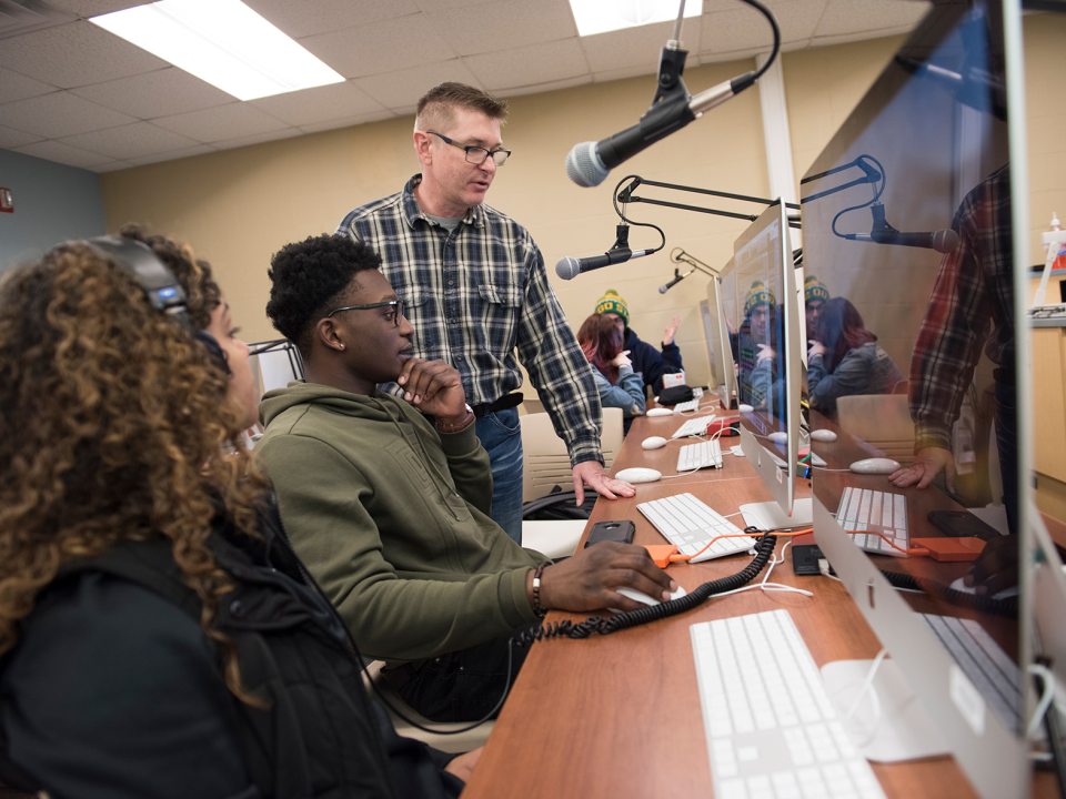 Faculty and students in media lab